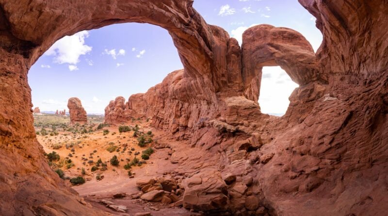 Captivating view of iconic rock formations in Arches National Park under a clear blue sky.